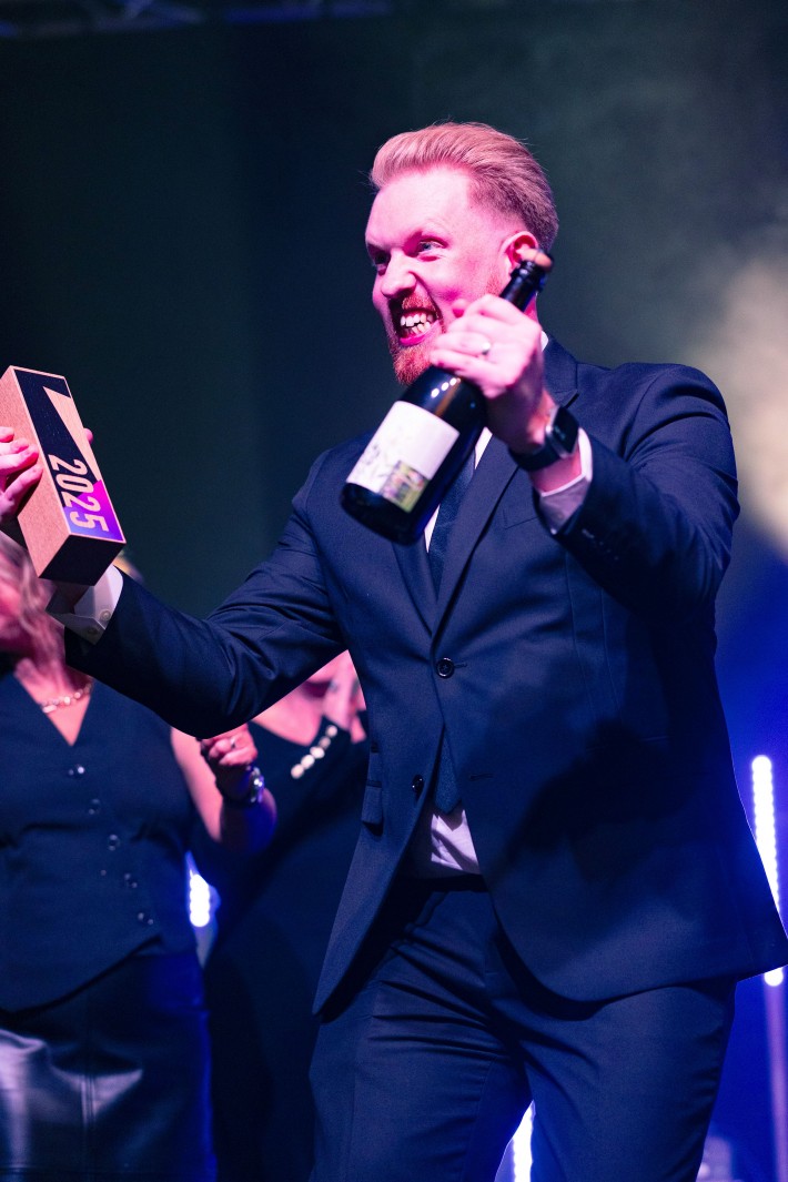 Bailey Nixon on stage after receiving his Top 30 Under 30 Award