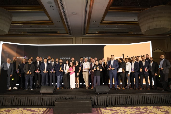 Winners gather on stage during the 2026 Construction Machinery Middle East Awards ceremony in Dubai.