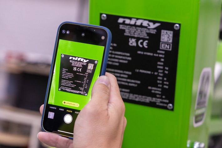 Scan Niftylift Serial Plate QR Code to Access MyNifty Mobile phone scanning a Niftylift serial plate QR code to access the MyNifty machine-specific support hub