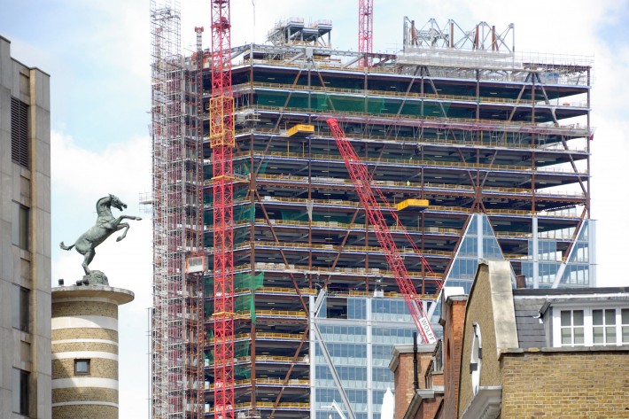 The access challenge on structural steel frames High-rise office block under construction on Bishopsgate in the City of London, with glass cladding panels being fitted to the exposed steel frame