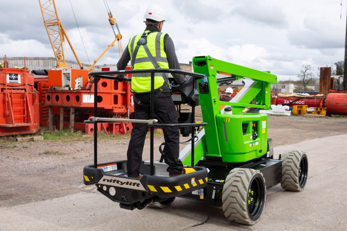 HR12 4x4 operating on a construction site with the impact-resistant ToughCage clearly visible