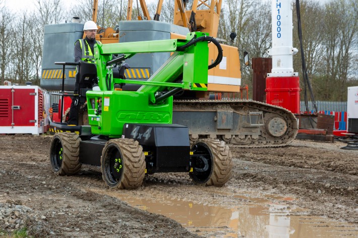 HR12 4x4 driving through mud and standing water on a construction site