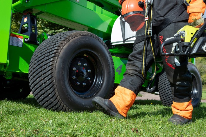 Tree Care worker walking next to SD64 Tree Care worker walking next to SD64